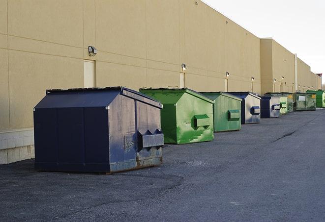 a row of industrial dumpsters for construction waste in Athol